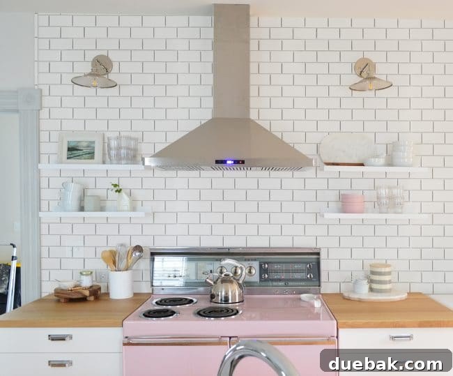 Kitchen mock-up with subway tile extending to the ceiling, showing a vertical bullnose at the doorway edge
