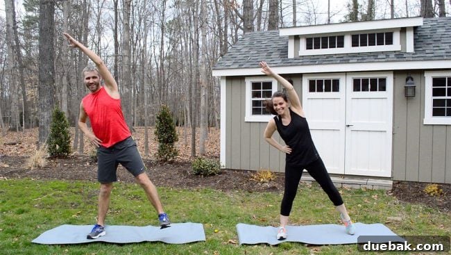 A person performing a dynamic lunging and reaching exercise.