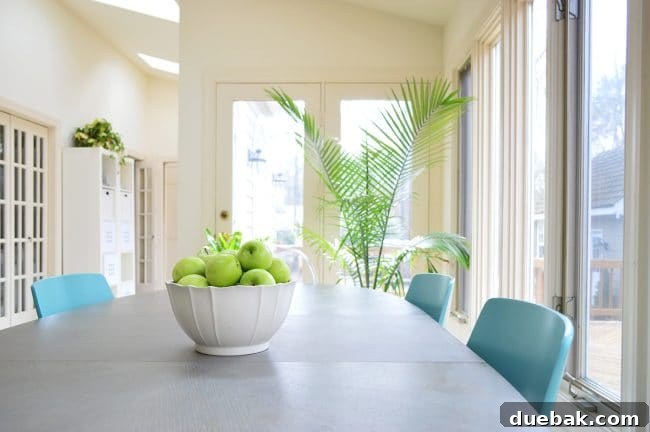 Home Staging Tips: Sell Your House or Simplify Your Life 2 kitchen table staged to sell with simple fruit bowl and green plants, illustrating the K.I.S.S. principle in home staging