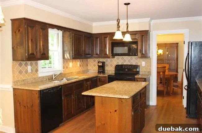 Home Staging Tips: Sell Your House or Simplify Your Life 17 before photo of kitchen with brown cabinets and tan backsplash, dated appearance