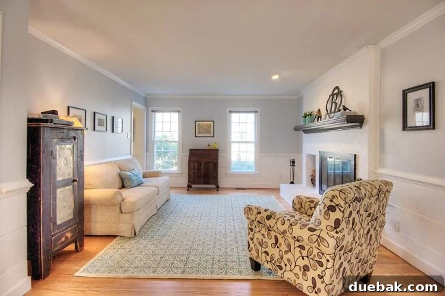 Home Staging Tips: Sell Your House or Simplify Your Life 21 living room staged to sell with neutral walls white fireplace and minimal furniture, showcasing spaciousness
