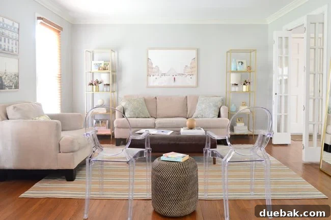 Home Staging Tips: Sell Your House or Simplify Your Life 23 neutral living room decorated with shelves artwork and lots of seating, styled for everyday living