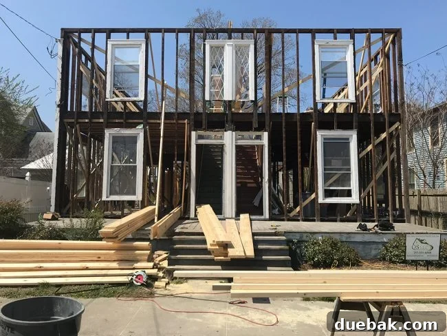 Our 30-Day Spending Detox 2 Gutted duplex interior showing exposed studs and no interior walls