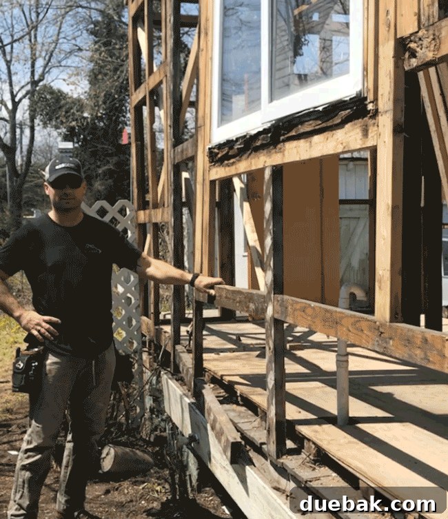 Contractor Sean shaking the poorly framed section of the house