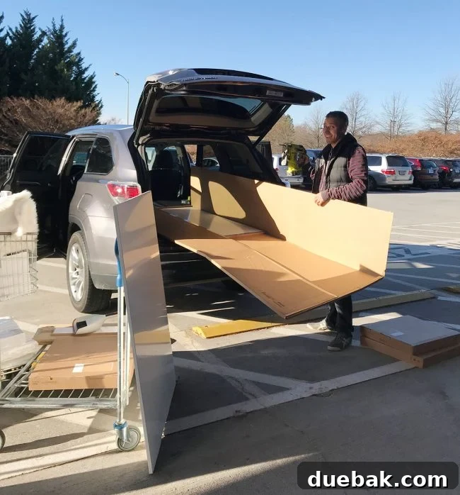 Cutting Ikea cover panels in a parking lot to fit them into an SUV.