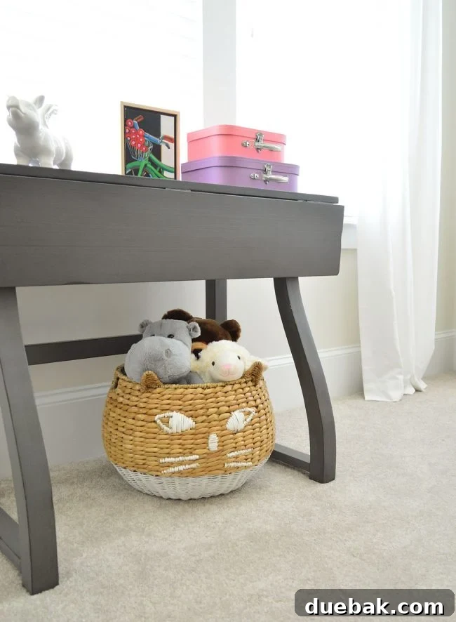 Close-up of the kitty basket and colorful storage suitcases in A's bedroom