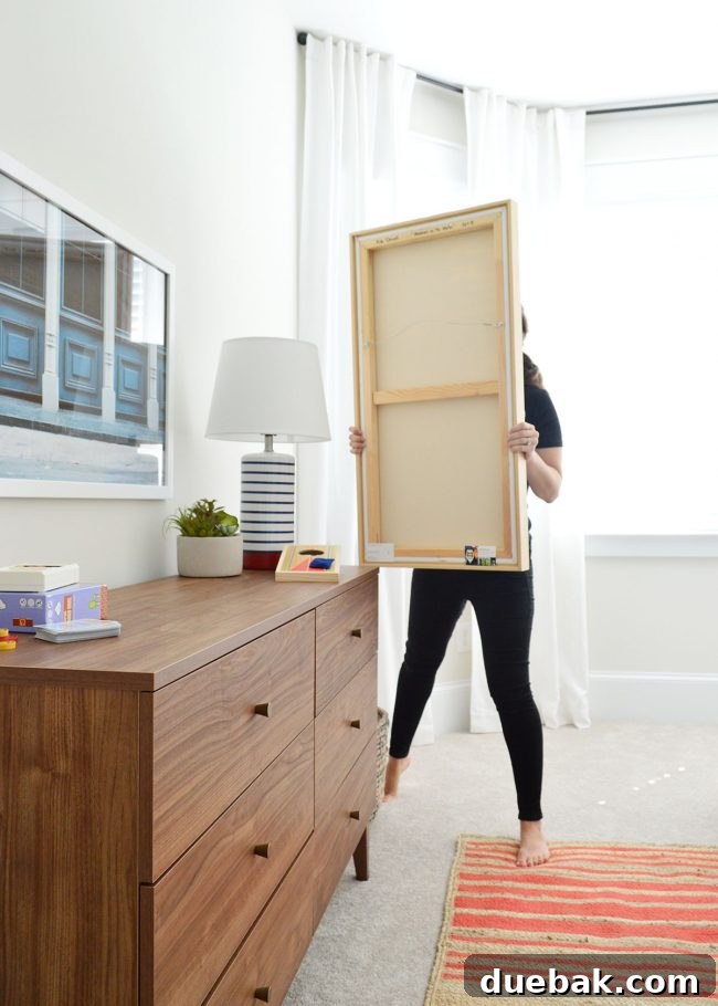 Behind-the-scenes shot with a person blocking glare for the art photo, showing the dedication to quality