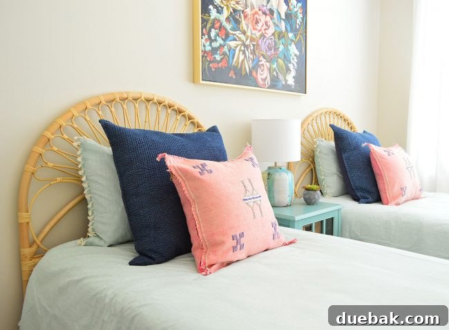 Overview of S's flexible bedroom design, showcasing two beds and versatile decor