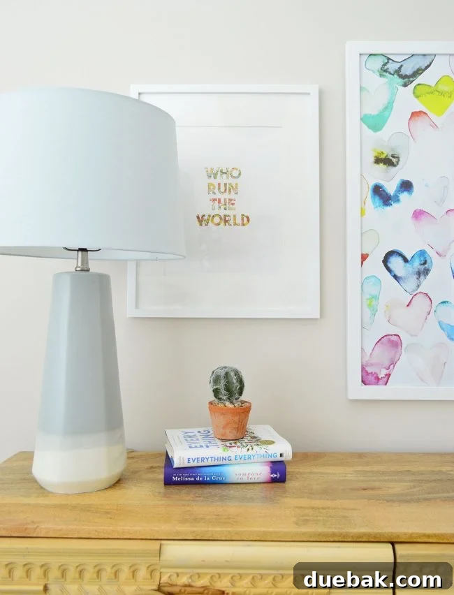 Close-up of 'Like A Boss' sign and gradient lamp, reinforcing empowering theme