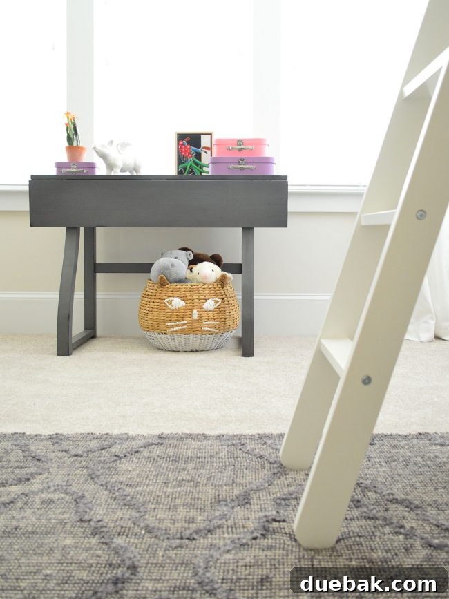 Accent table by the window in A's bedroom, adorned with colorful accessories and art