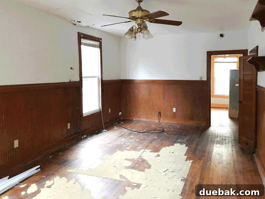 A GIF showcasing the transformation of the downstairs opening, from its original state, through demolition, to its current reframed and widened configuration.