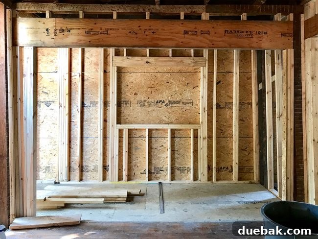 Widened opening between the kitchen and laundry/mudroom, showing the extra space left for the installation of pocket doors.