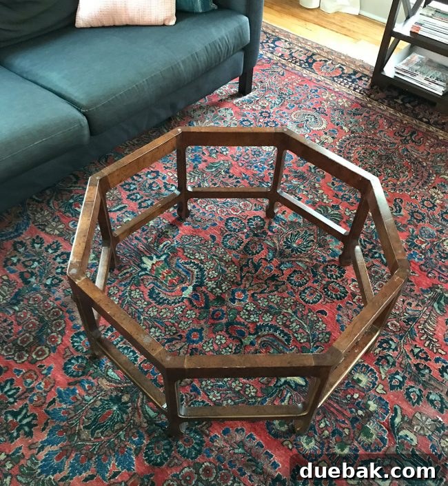 Person resting feet on the edge of the incomplete coffee table