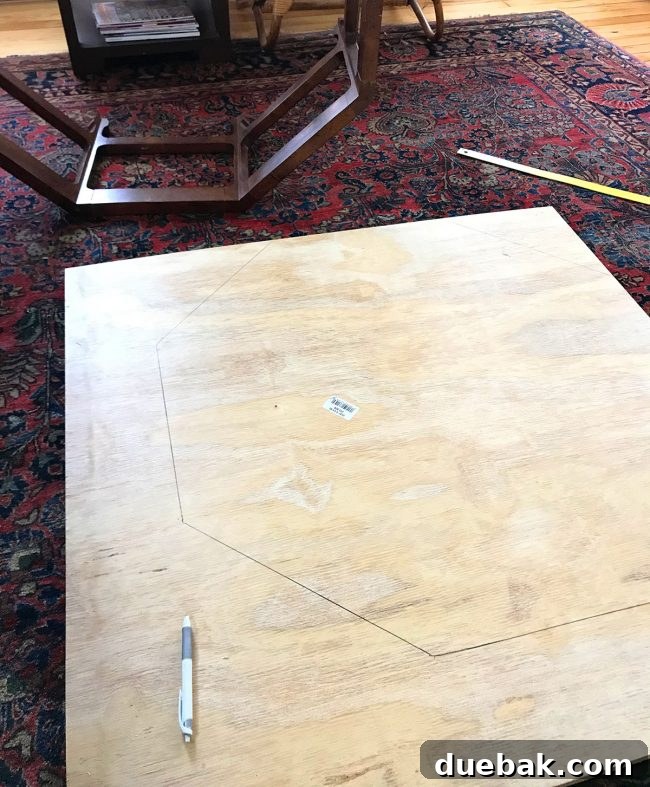 Tracing the octagonal table base onto plywood