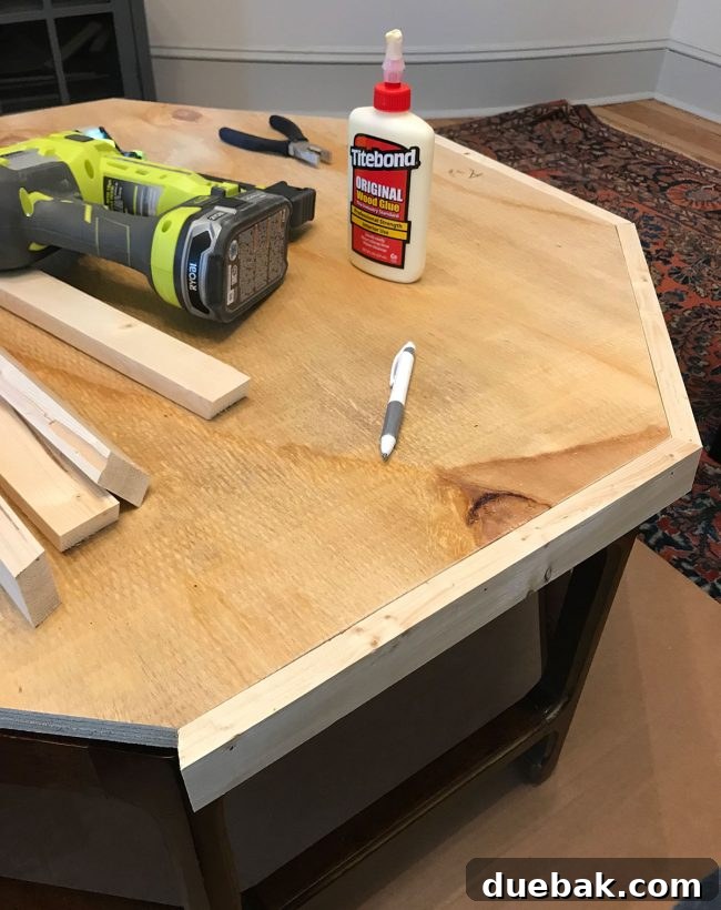 Attaching the wood border to the plywood top