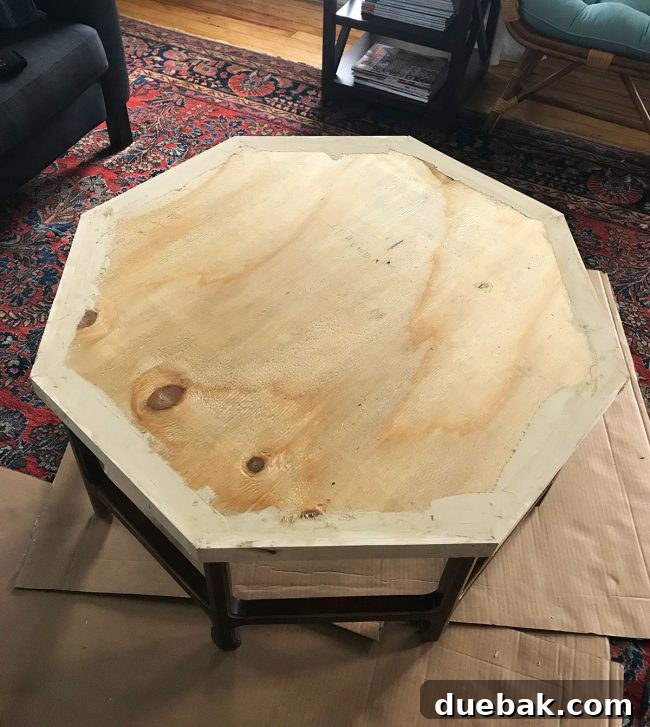 Wood putty applied to fill gaps and nail holes on the tabletop