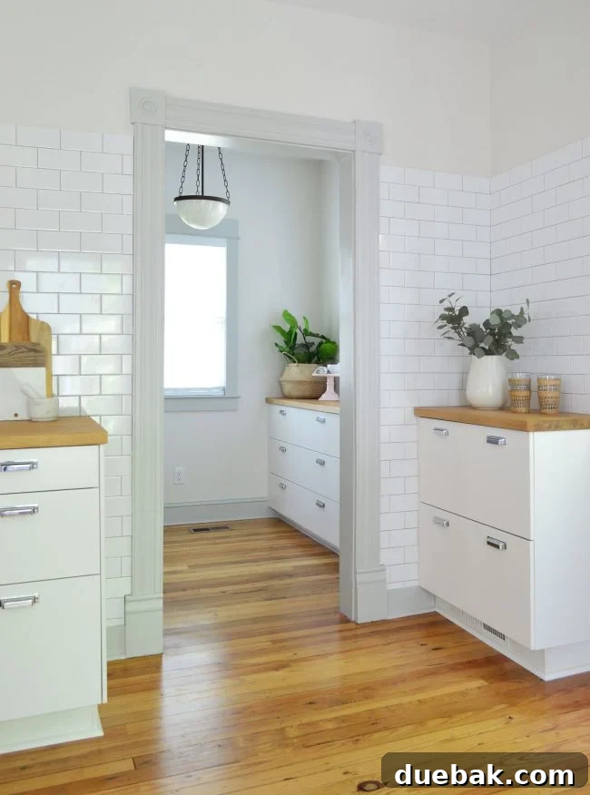 Are Kitchen Islands Hurting American Kitchens? 2 Close-up of a freshly tiled kitchen backsplash in a beach house