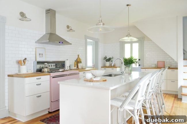 Are Kitchen Islands Hurting American Kitchens? 3 Kitchen island with a sink in a modern beach house kitchen