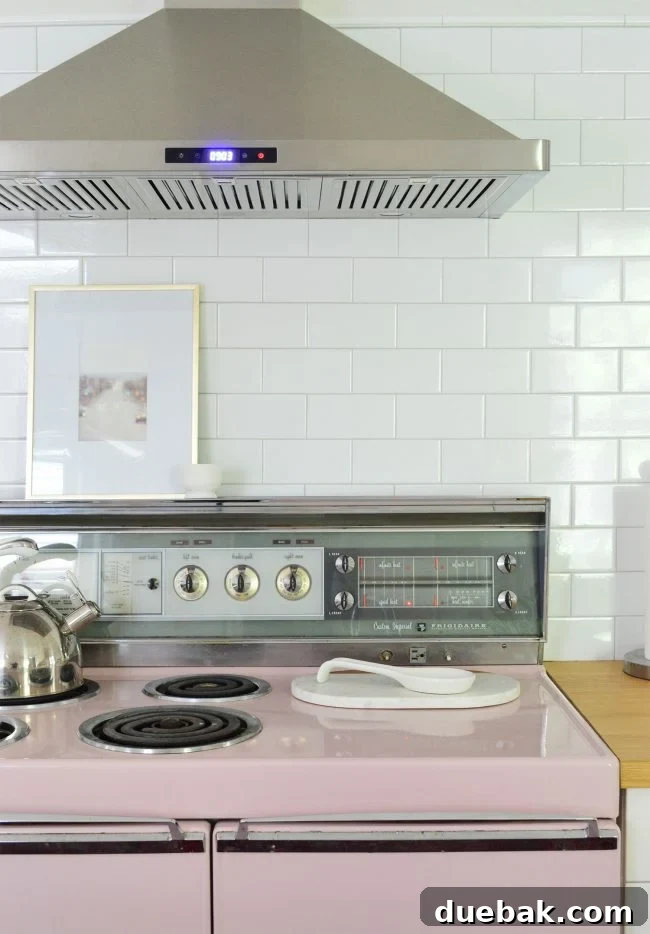 Vintage pink stove in a renovated kitchen
