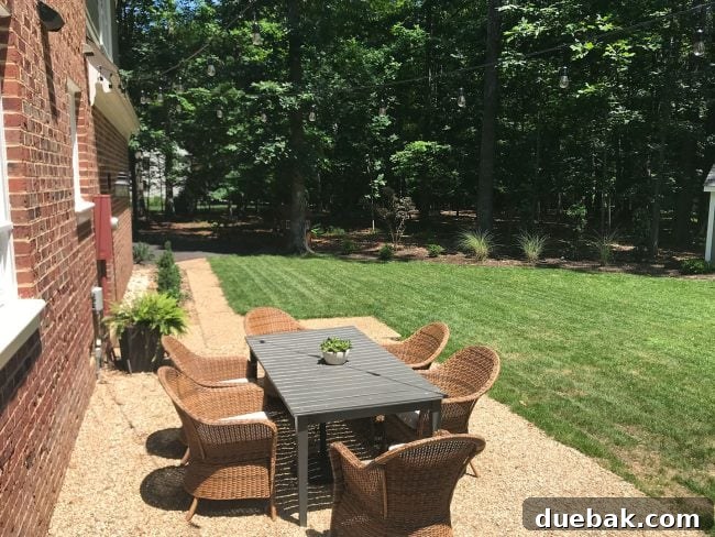 Out With the Deck, In With a Pea Gravel Patio 12 Our temporary pea gravel patio furnished with outdoor seating, showcasing its functional appeal.