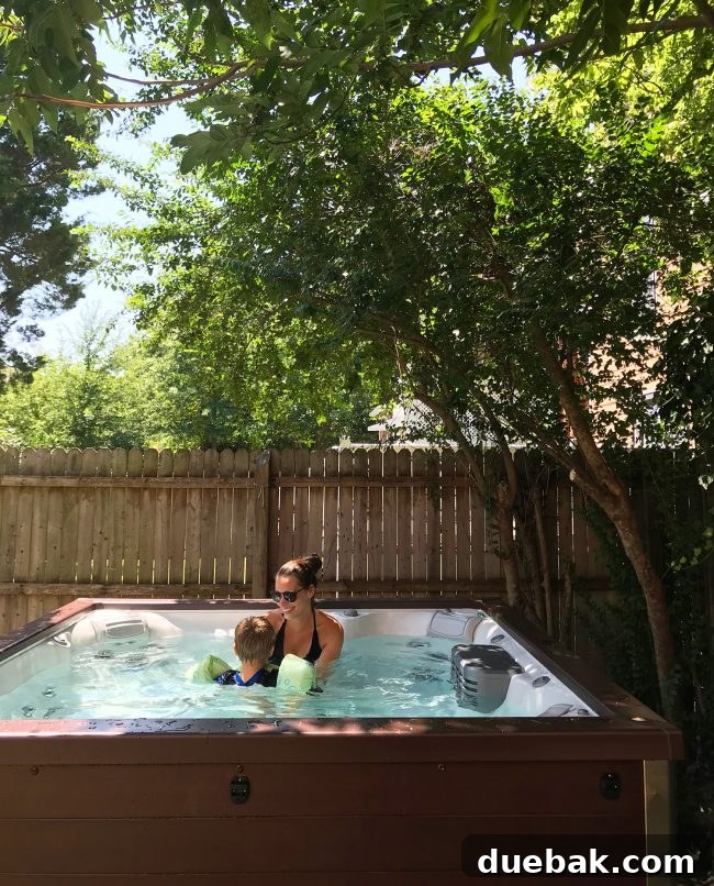 Recently installed Jacuzzi hot tub in an unfinished backyard