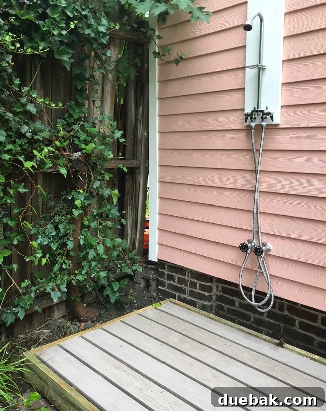 Installed outdoor shower base with Azek planks for comfort