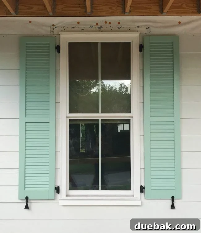An installed shutter, showing the slight gap when closed, illustrating the 'appearance of operable' requirement.