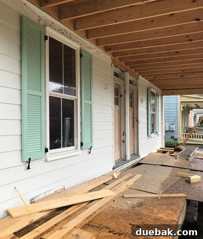 Newly installed, historically compliant shutters on the duplex, showing their authentic appearance.
