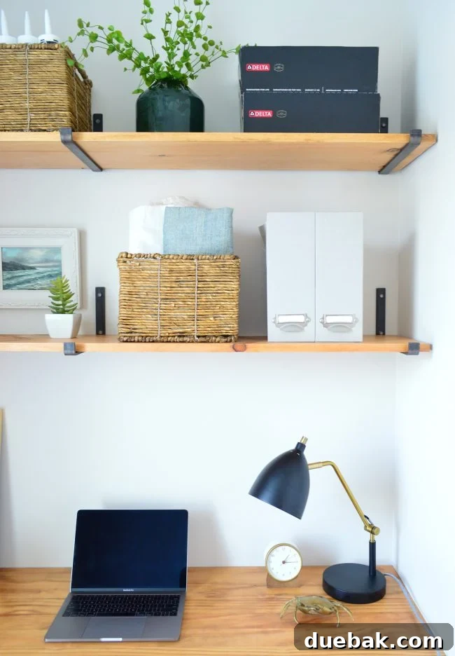 Close-up of organized desk items including a clock, lamp, and magazine files