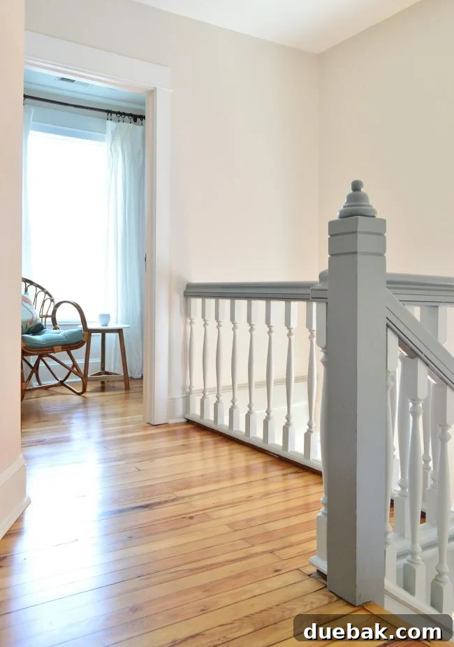 Transformed beach house upstairs landing with new floors and fresh walls