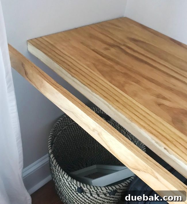 Close-up of DIY desk with front trim piece for finished look