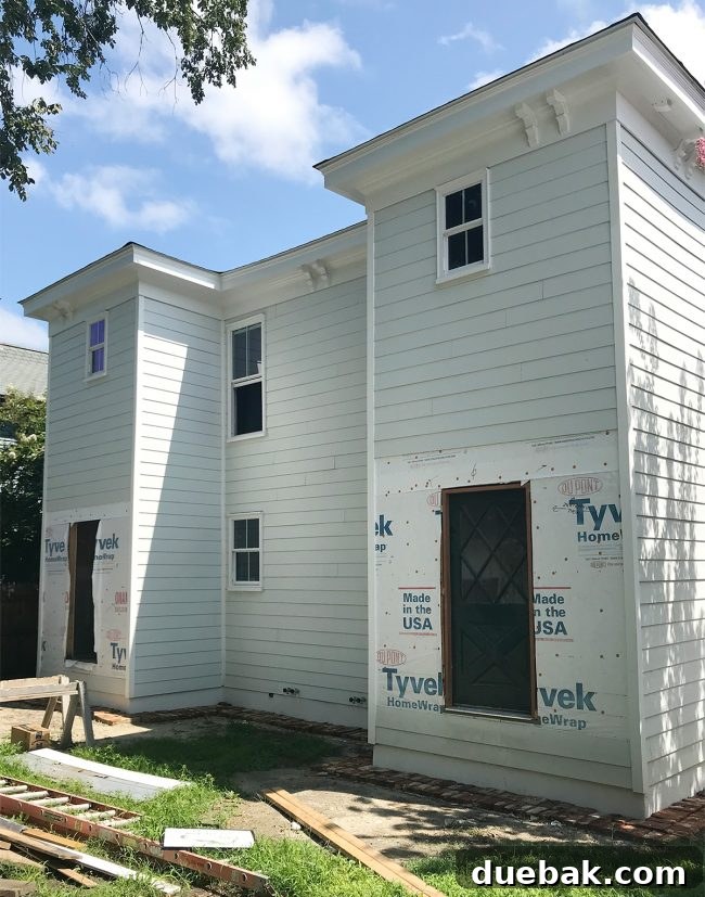 View of the backyard with the first diamond door already hung, awaiting a mint paint job