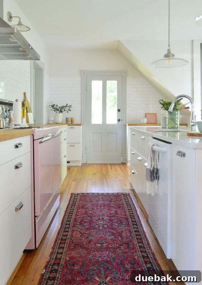 Our Beach House Downstairs: Before and After 21 Renovated beach house kitchen with pink stove