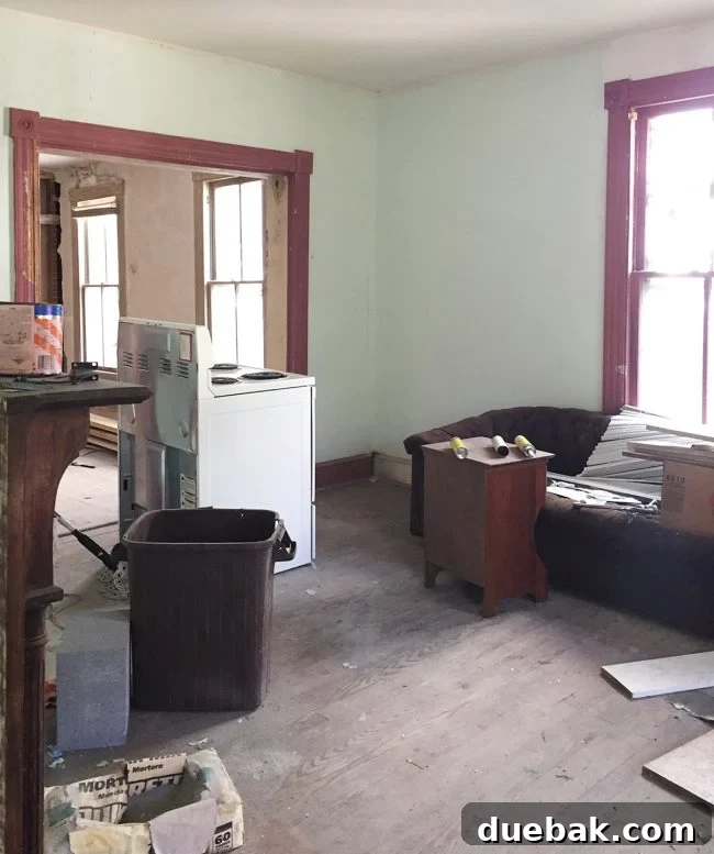 Our Beach House Downstairs: Before and After 40 Living room looking into dining before renovation