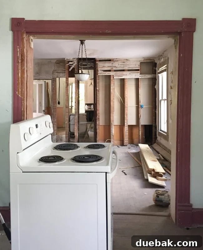 Our Beach House Downstairs: Before and After 42 Living room looking into dining and kitchen before