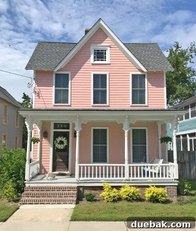 Our Beach House Downstairs: Before and After 6 Pink beach house exterior after renovation
