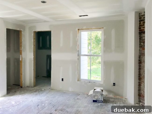 The Duplex Takes Shape Drywall And Video Tour Reveal 14 Main bedroom with exposed brick chimney feature