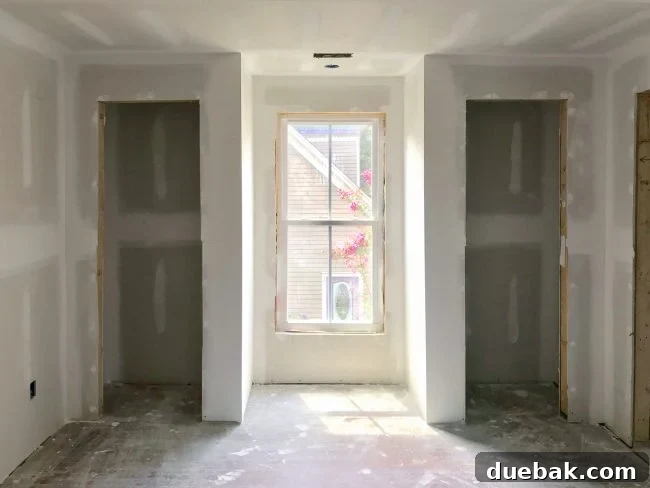 The Duplex Takes Shape Drywall And Video Tour Reveal 15 Main bedroom showing new closets and future window bench area
