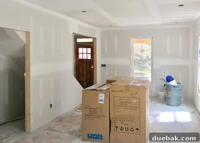 The Duplex Takes Shape Drywall And Video Tour Reveal 10 View towards the front door and living area