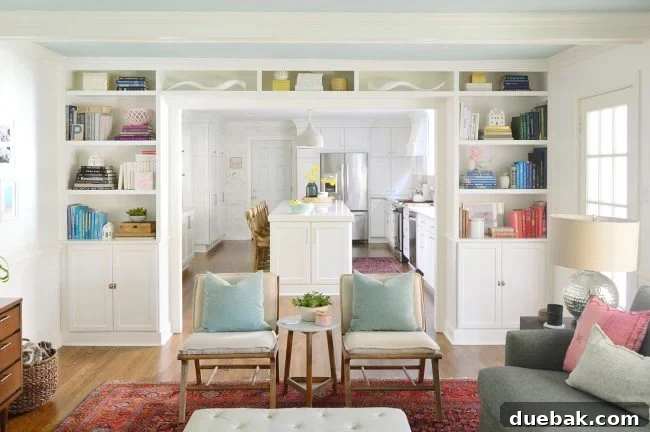 Built-in bookshelves in a living room, previously filled with numerous colorful books and decorative objects.