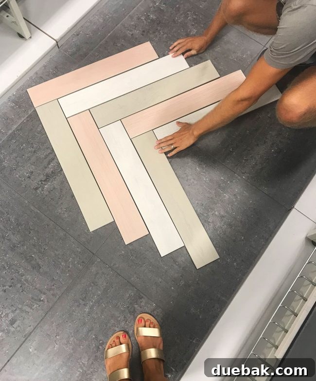 Three different color porcelain tile planks arranged in a herringbone pattern on a store floor, demonstrating a design idea.
