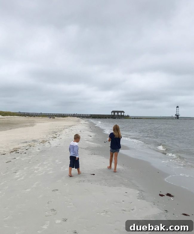Overcast but calm scene at Cape Charles beach after Hurricane Florence skirted the area, with damp sand showing previous high water marks.