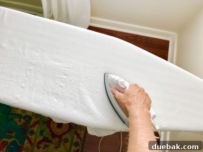 High-End Ikea Curtain Hacks 22 ironing ikea lenda curtains on ironing board