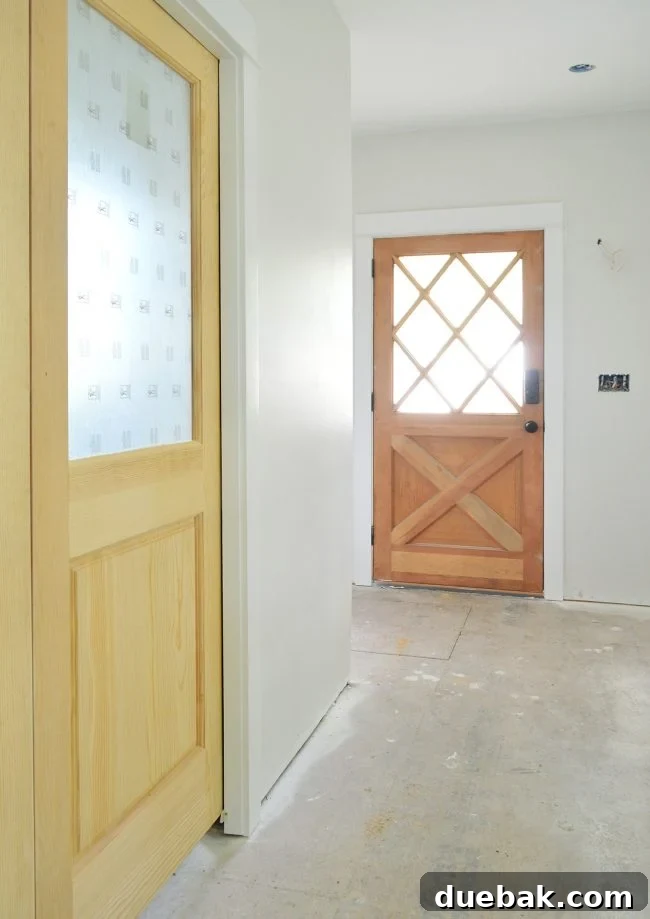Close-up of newly installed pocket doors with protective paper on glass