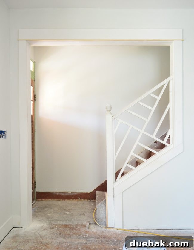 Newly installed Chippendale railing at the top of the duplex stairs