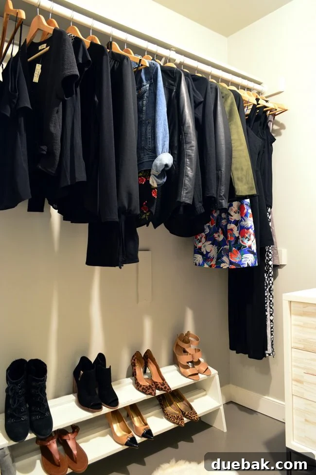 Sherry's organized and minimalist closet section with clothes neatly hung.