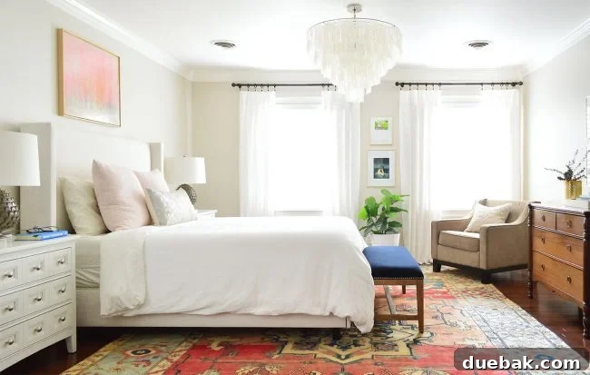 Bedroom with a new bed and two white dressers functioning as nightstands.