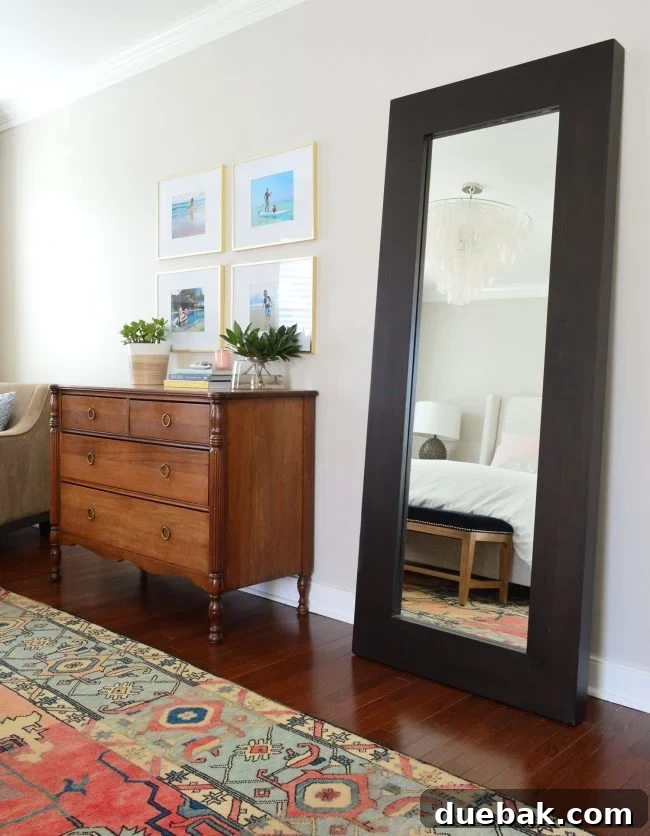 Large floor mirror in a bedroom, reflecting light and adding depth.