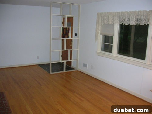 A bright, open living room with modern furnishings and natural light, showcasing a harmonious design.