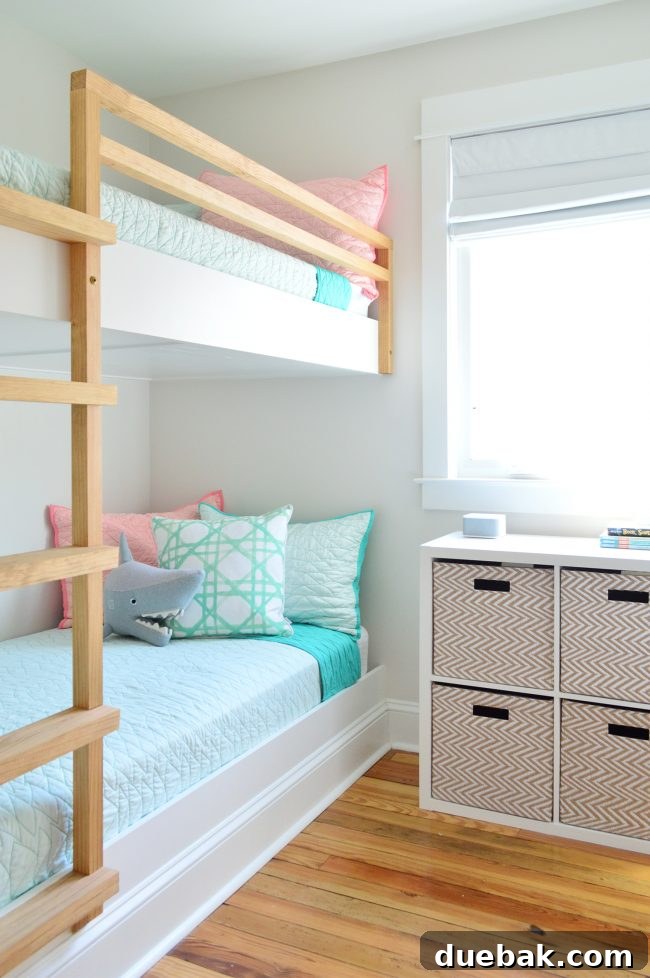 Our Beach House Makeover: Upstairs Edition 16 Rebuilt bunk room in beach house with built-in bunk beds and clean decor